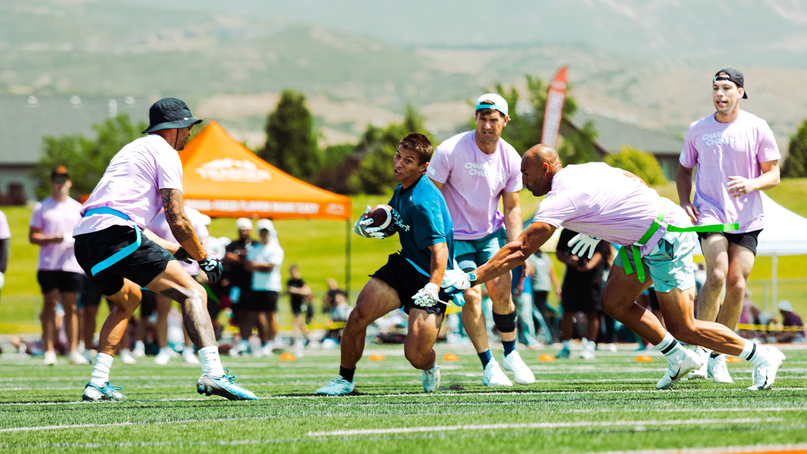 Flag football scramble with multiple players